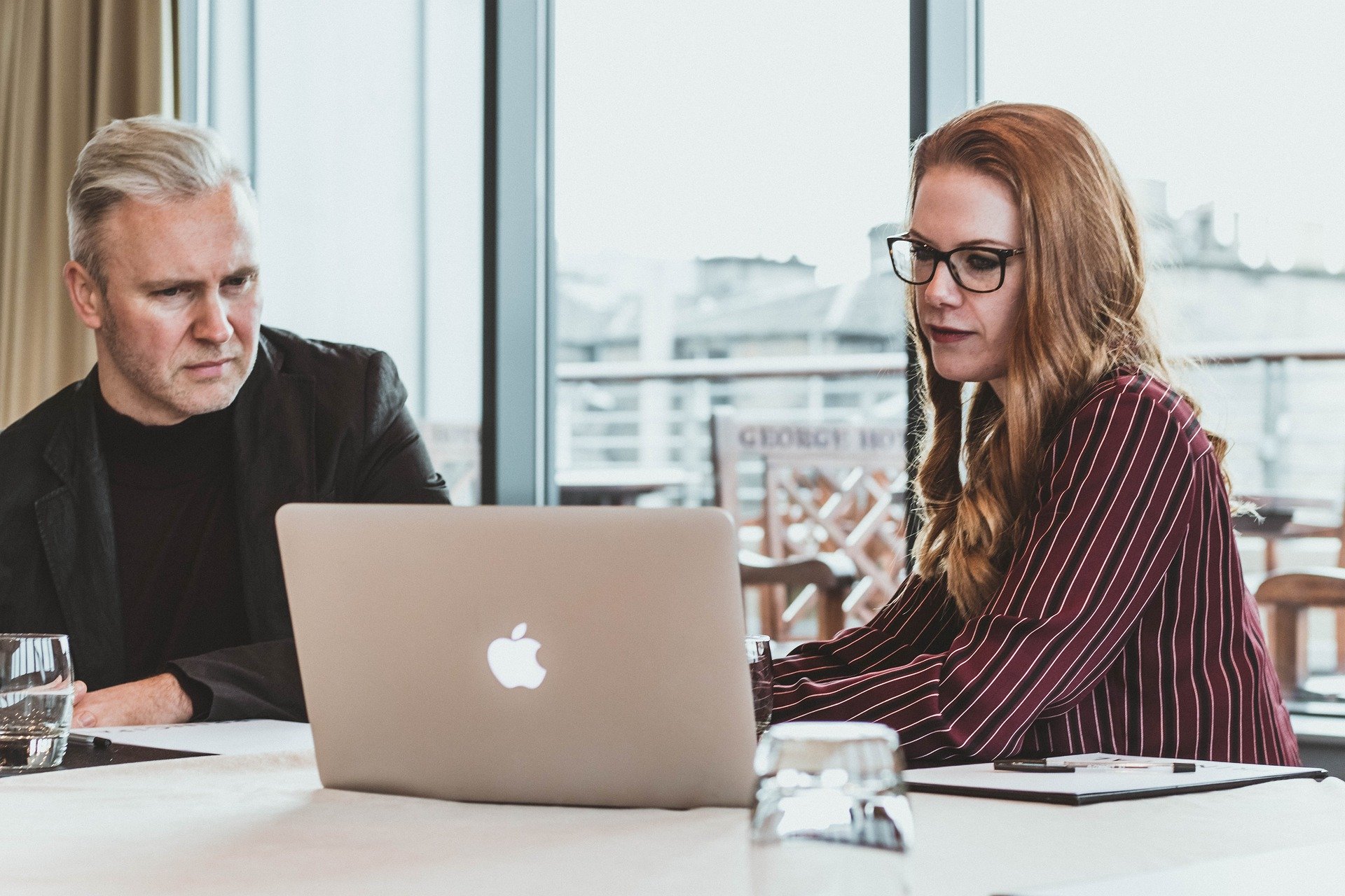 Man and woman learning over computer.