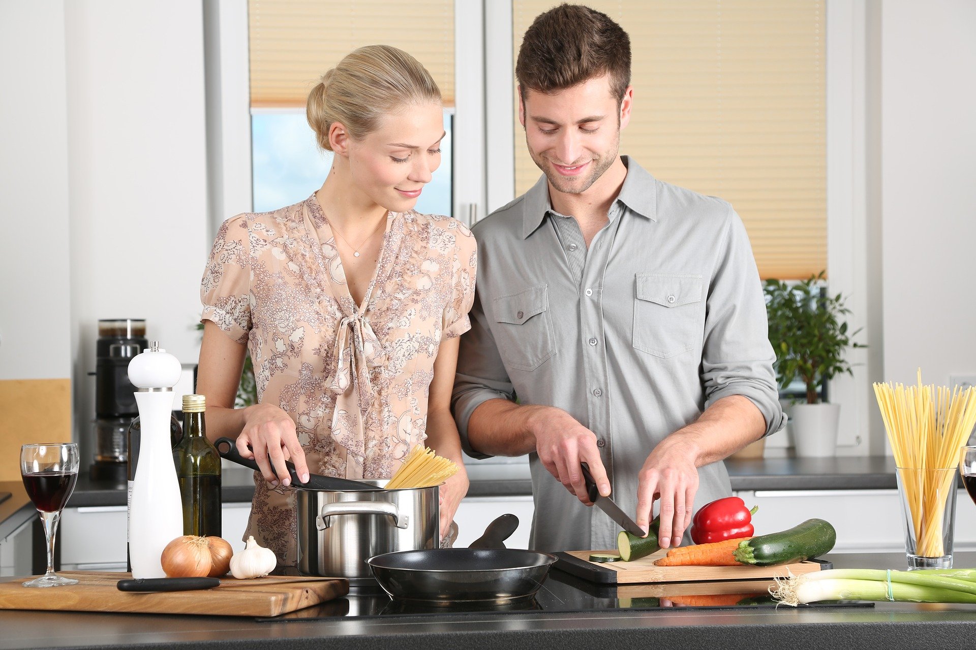 Man and woman in a kitchen, cooking